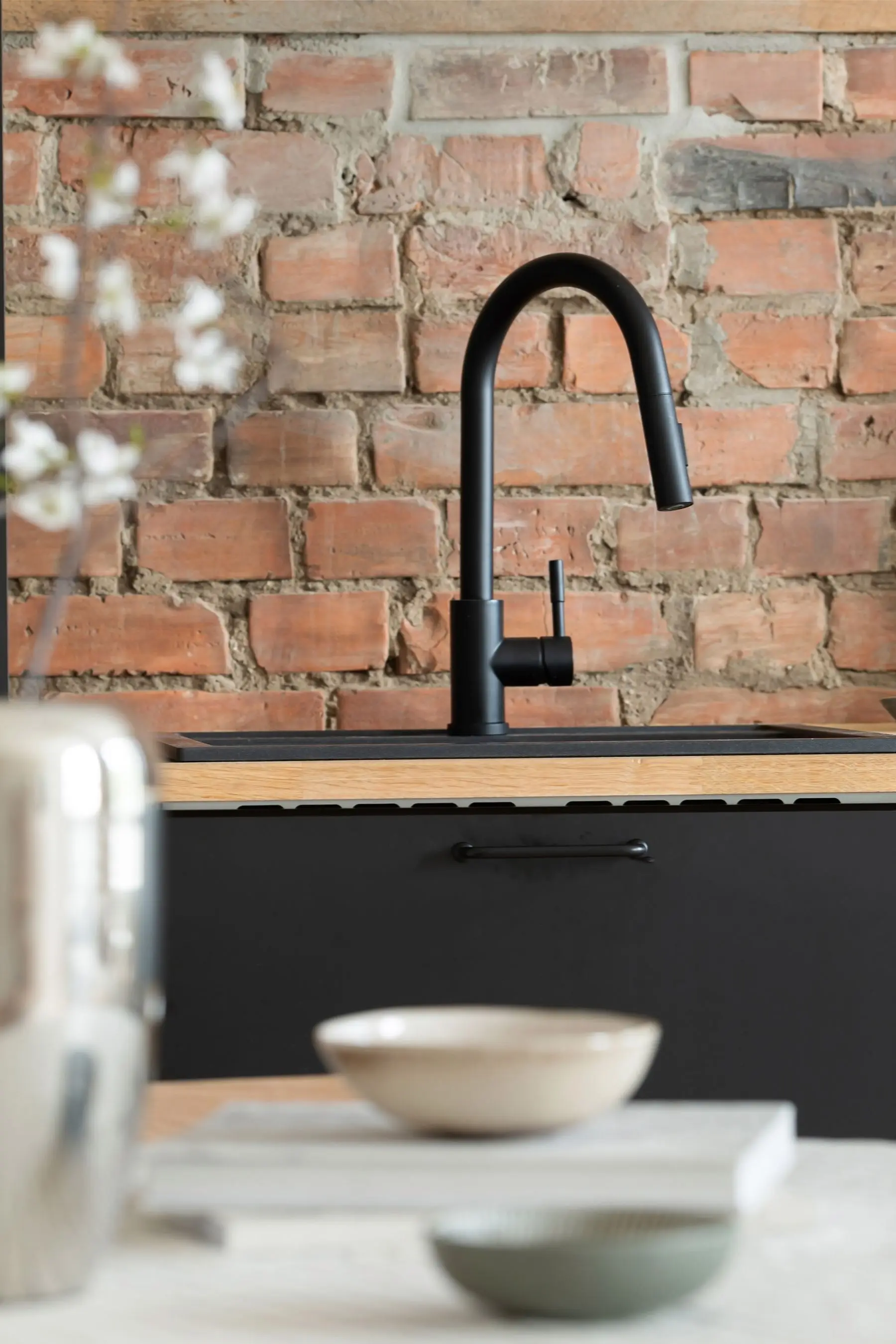 Kitchen re-plumb behind an original brick wall