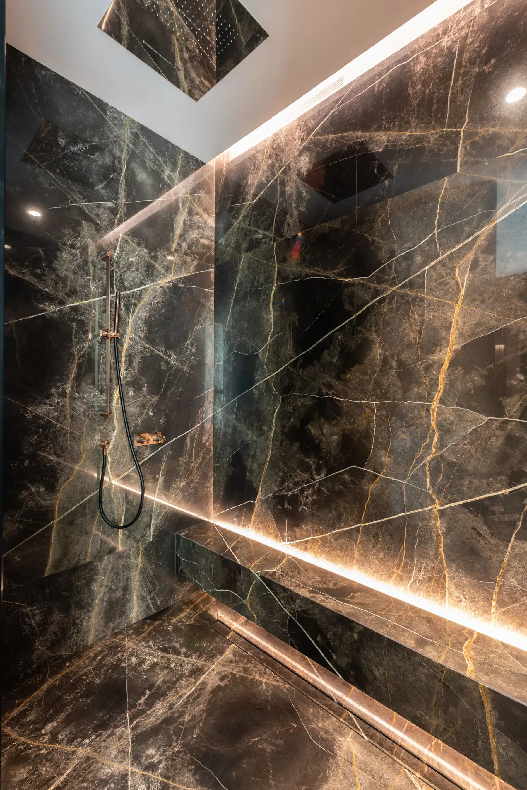 Lit marble bath, all services concealed