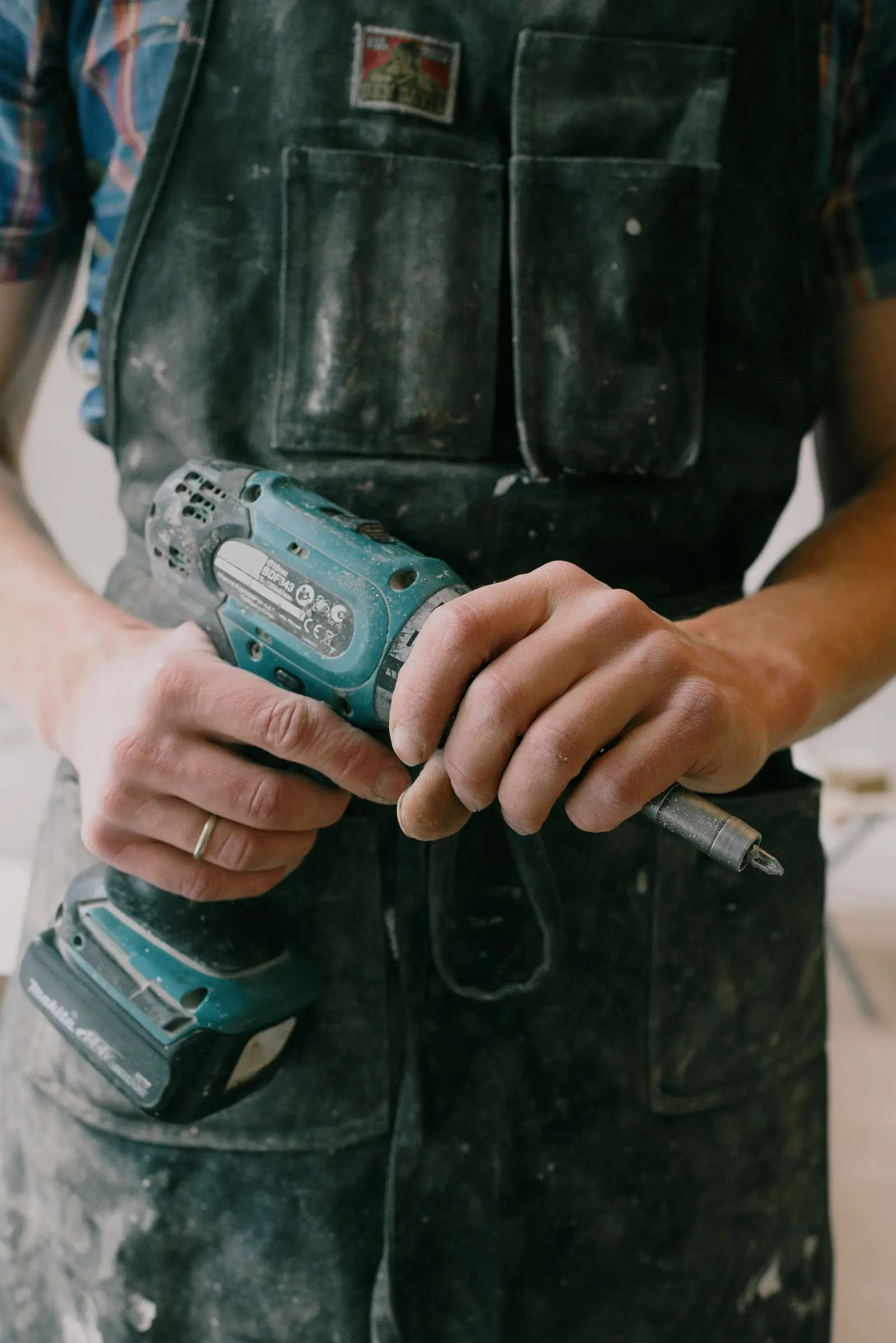 A Stillwater plumber working in a customer’s apartment