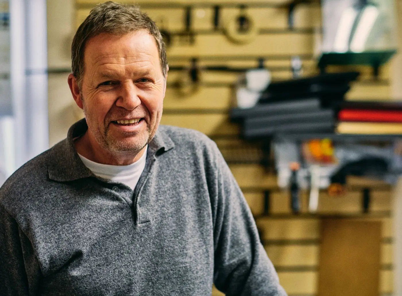 Portrait of the owner of Stillwater Plumbing beside a service van